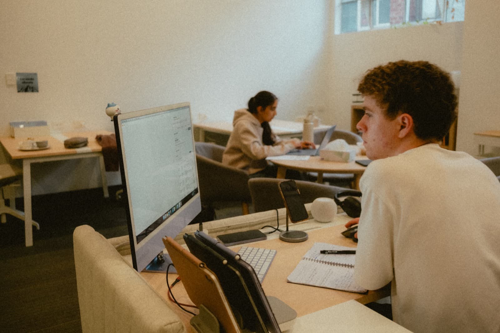 Tutors and students working at desks in the Altitutor learning centre